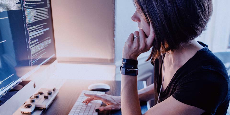 computer programmer in front of a computer